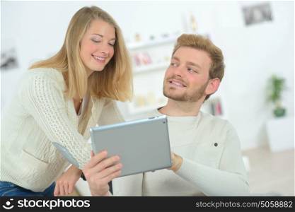Couple in love with their tablet
