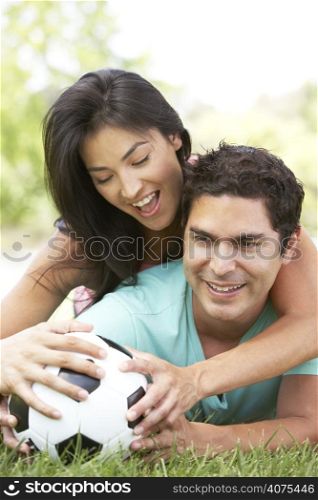 Couple In Park With Football
