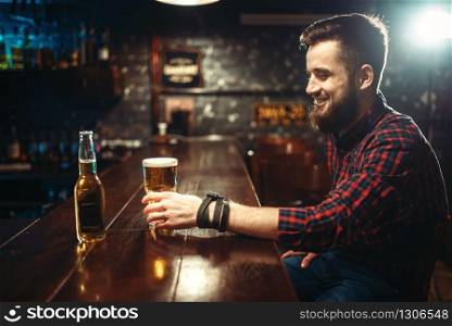 Couple in quarrel, man and woman clarify the relationship in bar. Lovers in pub, husband and wife in nightclub, bad mood