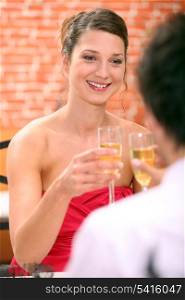 Couple in restaurant with champagne flutes