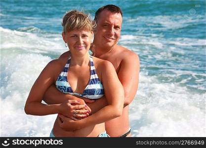 couple in sea waves