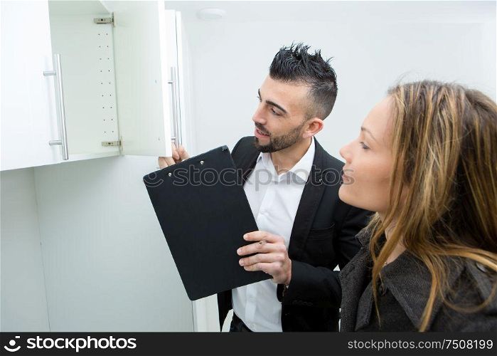 couple in searching the real estate for a purchase