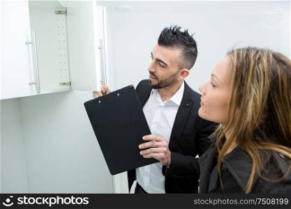 couple in searching the real estate for a purchase