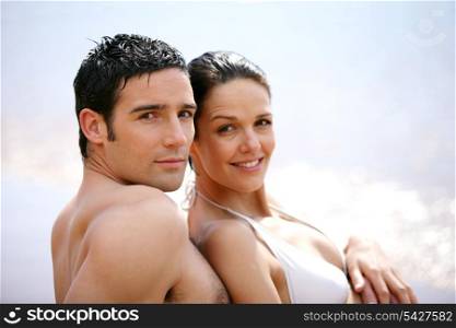 Couple in swimsuit at the oceanside