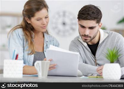 couple in the home looking through paperwork
