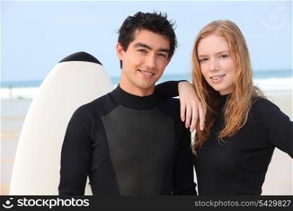 Couple in wetsuits