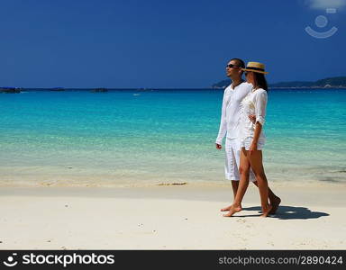 Couple in white on a tropical beach