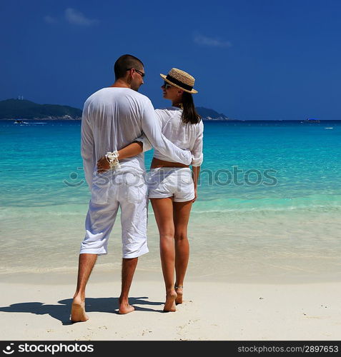 Couple in white on a tropical beach