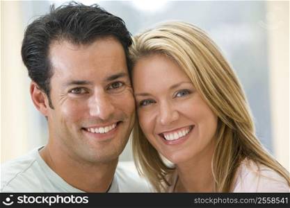 Couple indoors smiling