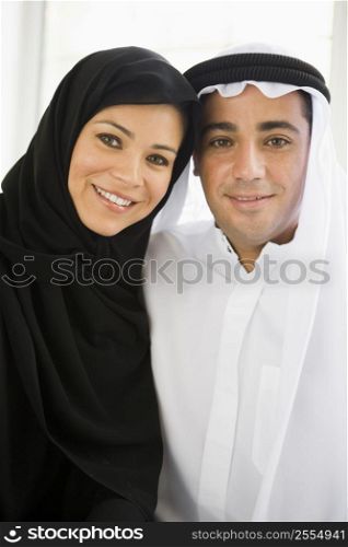 Couple indoors smiling (high key)