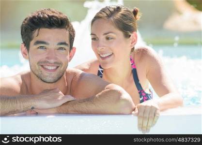 couple inside the jacuzzi pool