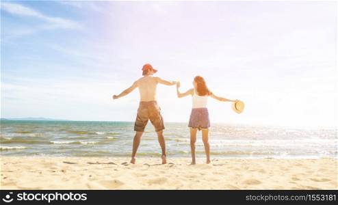 Couple is Jumping in beach