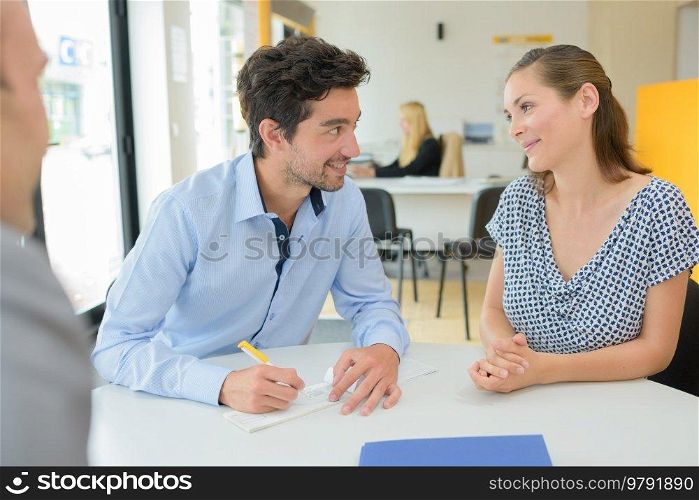 couple is signing a cheque