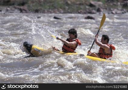 Couple Kayaking Colorado River Moab Utah