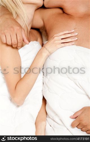 Couple kissing each other at sleep