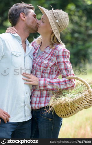 couple kissing in the farm