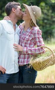 couple kissing in the farm
