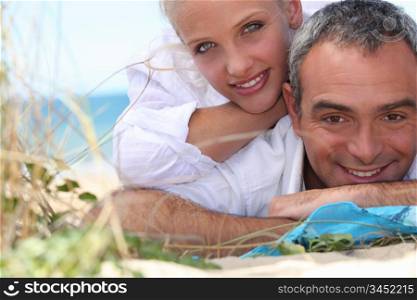 Couple, laid down at the beach