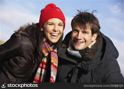 Couple Laughing In The Park Together