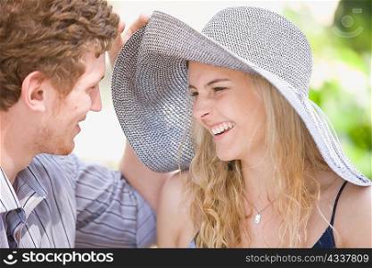 Couple laughing together outdoors