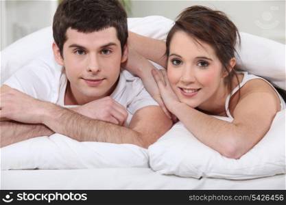 Couple laying in bed