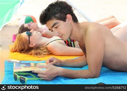 Couple laying on a beach