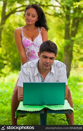 couple loking in laptop