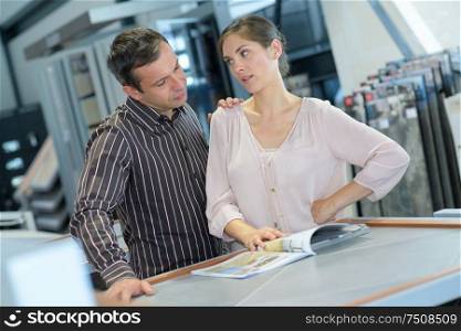 couple looking around kitchen of house for sale