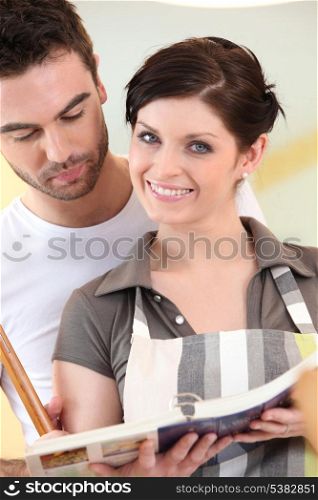 Couple looking at a cookbook