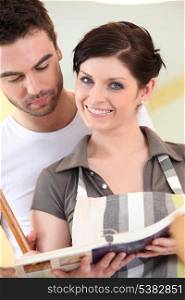 Couple looking at a cookbook