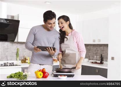 Couple looking at a digital tablet