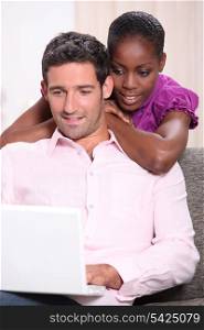 Couple looking at a laptop