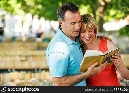 Couple Looking at Book