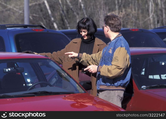 Couple Looking at Cars