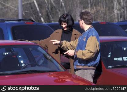 Couple Looking at Cars