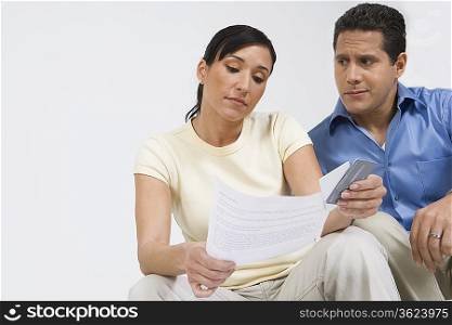 Couple Looking at Credit Card Bill