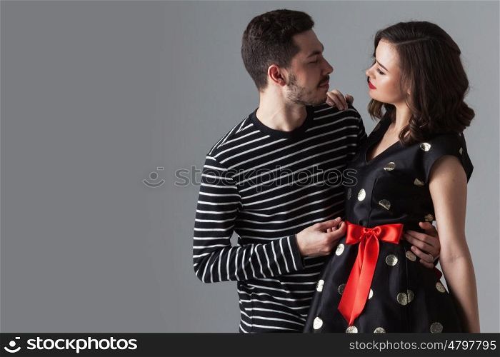 Couple looking at each other. Beautiful young loving couple hugging and looking at each other