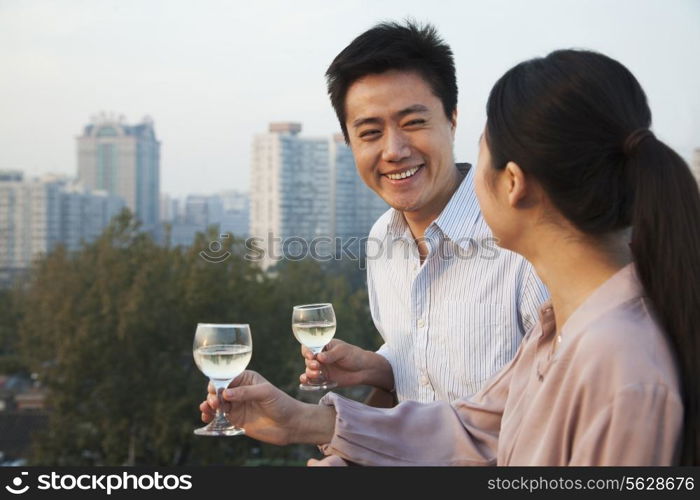 Couple Looking at Each Other with Cityscape