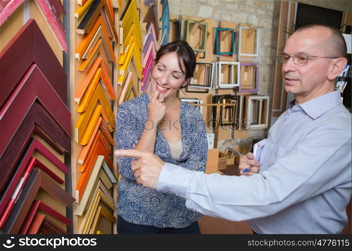couple looking at frames
