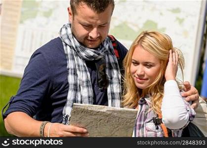 Couple looking at map on city break vacation leisure togetherness