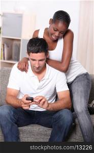 Couple looking at mobile phone
