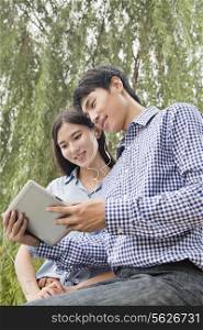 Couple Looking at Tablet Together