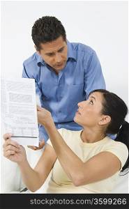 Couple Looking at Tax Form