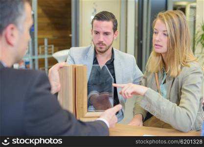 couple looking at window samples