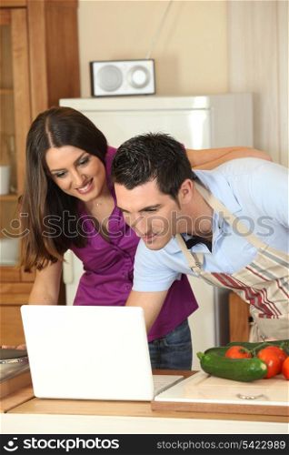 Couple looking for a recipe on the internet