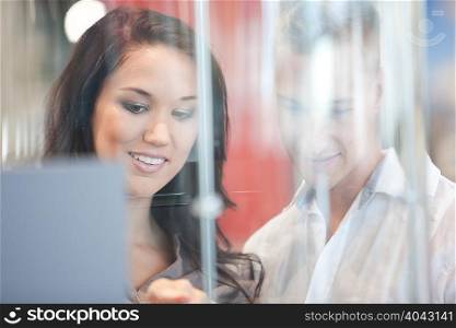 Couple looking in glass case