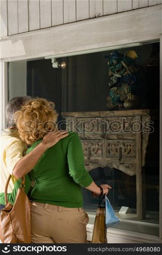 Couple looking in shop window