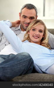 Couple lounging comfortably on a sofa