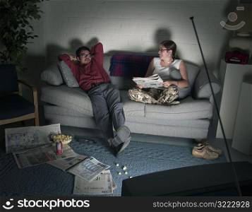 Couple Lounging Watching Television