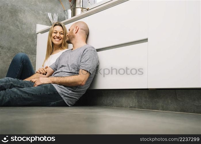 couple love floor kitchen